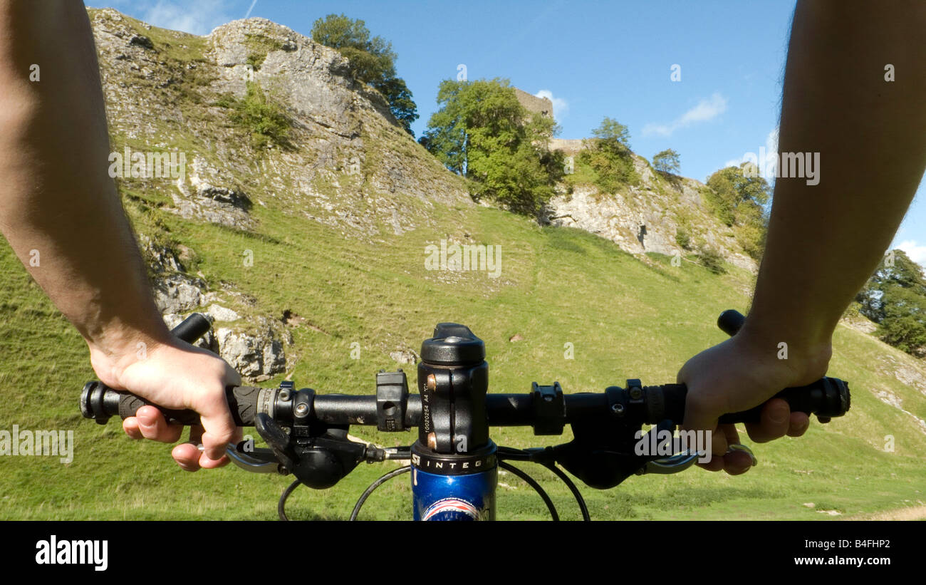 Mountain biking through Cavedale Castleton Peak District National Park Derbyshire England UK GB Stock Photo