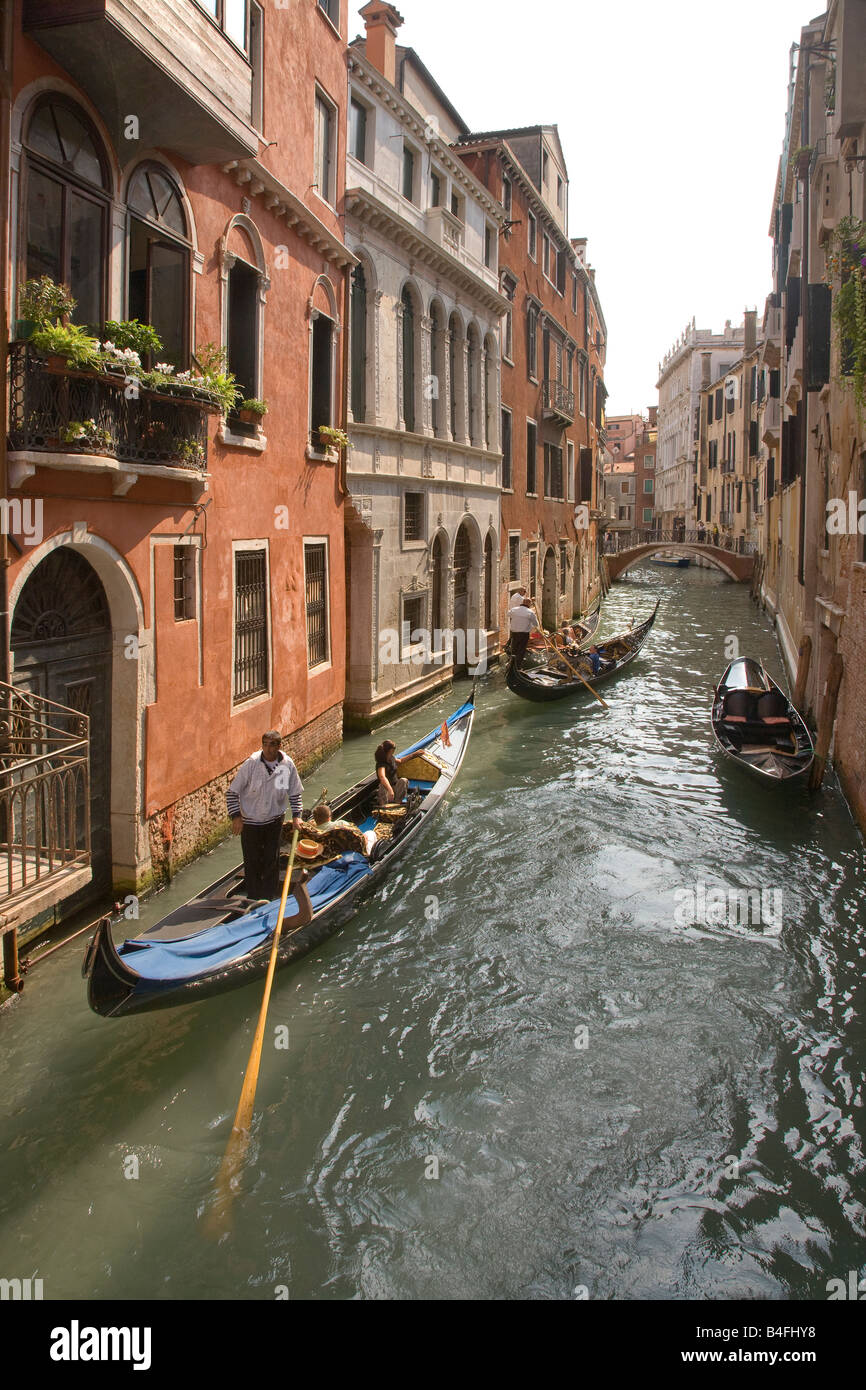 Venice, Italy, Gondolas with tourists cruising a side canal Stock Photo