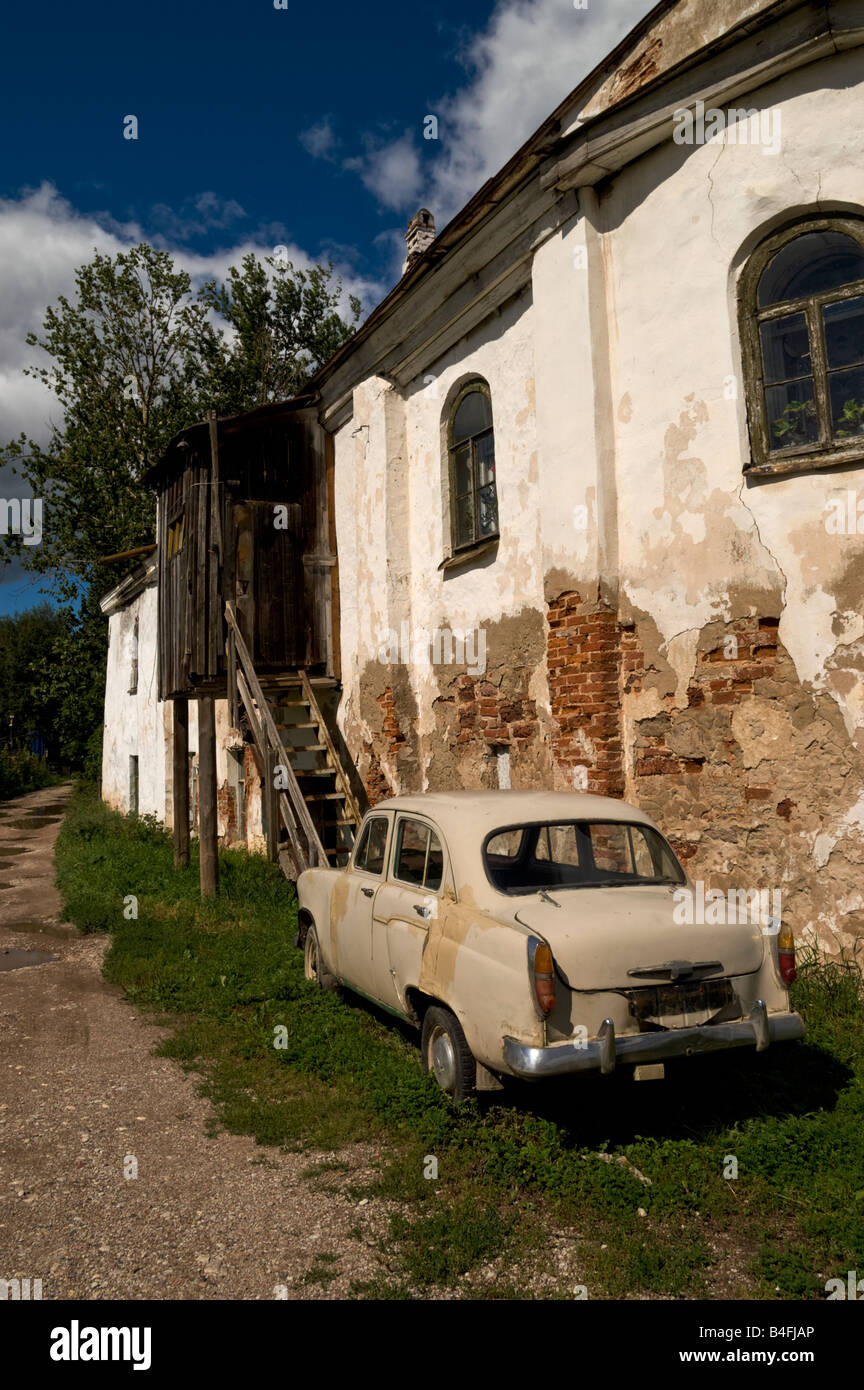 Run-down Soviet era automobile 'Moskvitch-403' by the Church of St Elijah-on-the-Slavna in Novgorod the Great (Russia) Stock Photo