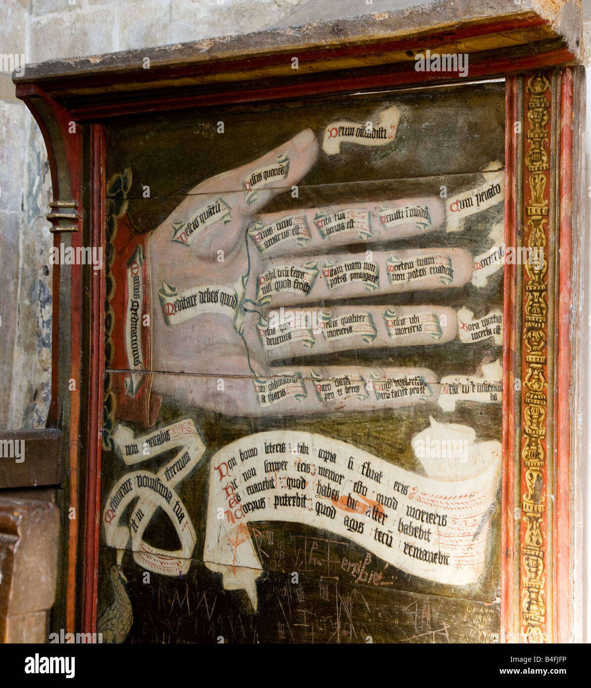 The 'Hand of Meditation' on the back of a single seat pew in St.Mary's Church, Bishops Canning, Wiltshire, England, UK Stock Photo