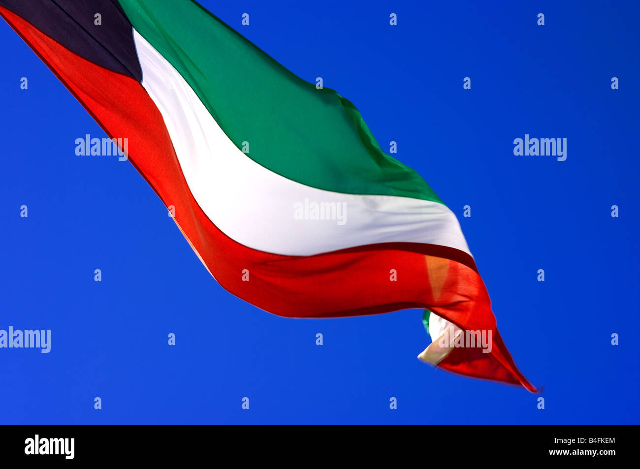 Kuwait's flag in the wind. Stock Photo