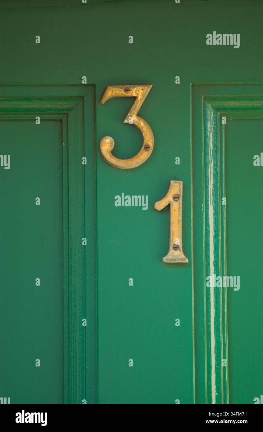 detail-of-green-painted-wooden-front-door-showing-number-31-of-house-B4FM7H.jpg