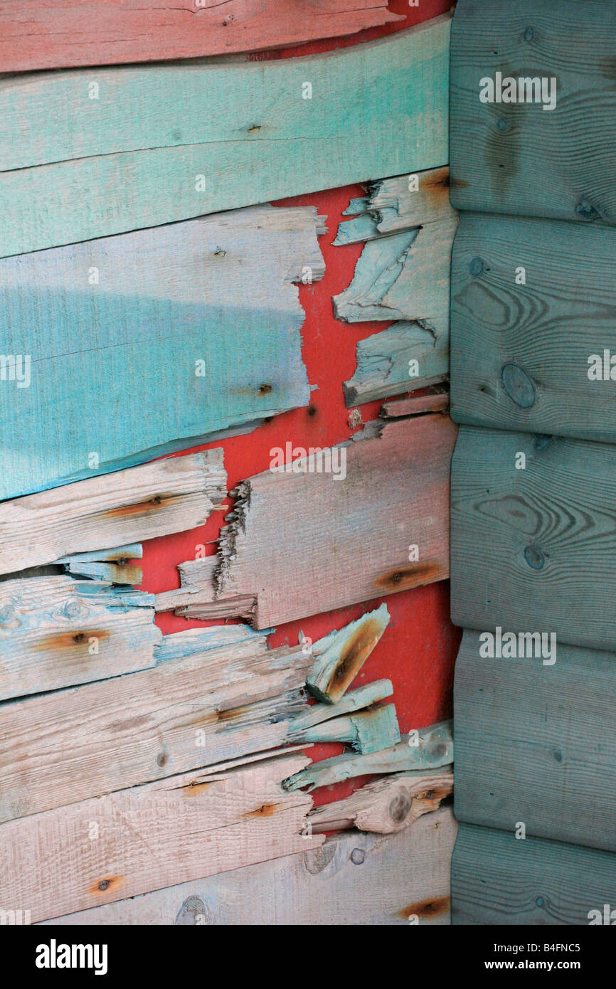 Delapidated colourful painted timber shed Stock Photo