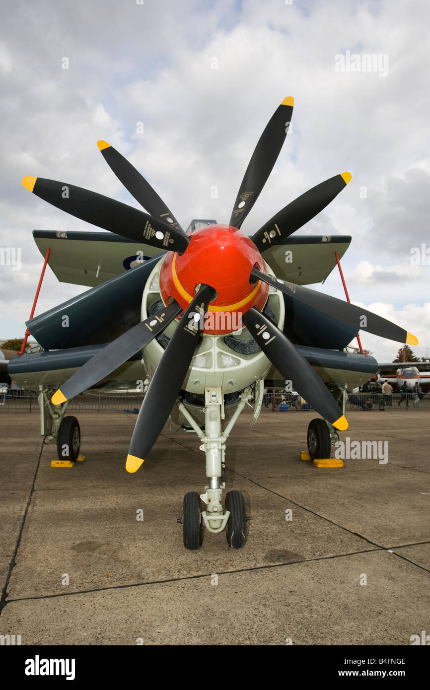 Military turbo prop plane with wings folded Stock Photo