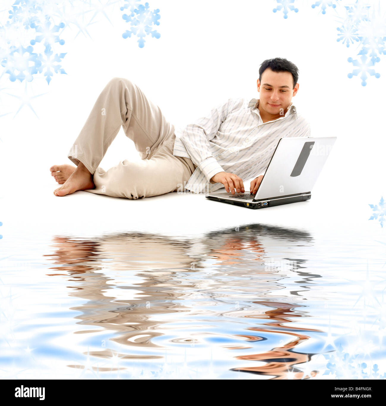 relaxed man with laptop computer on white sand Stock Photo - Alamy
