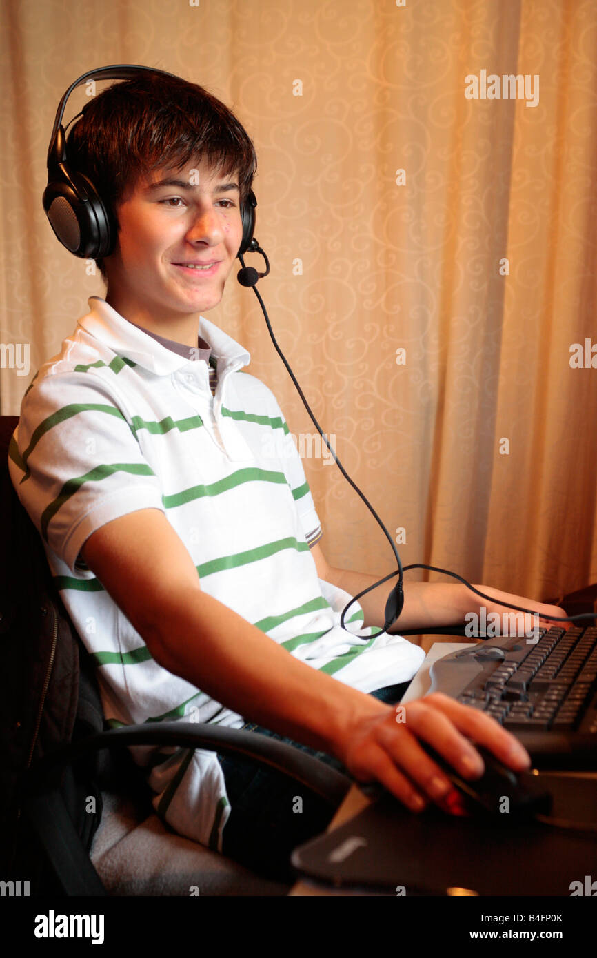 Portait of a teenage boy in front of his computer Stock Photo