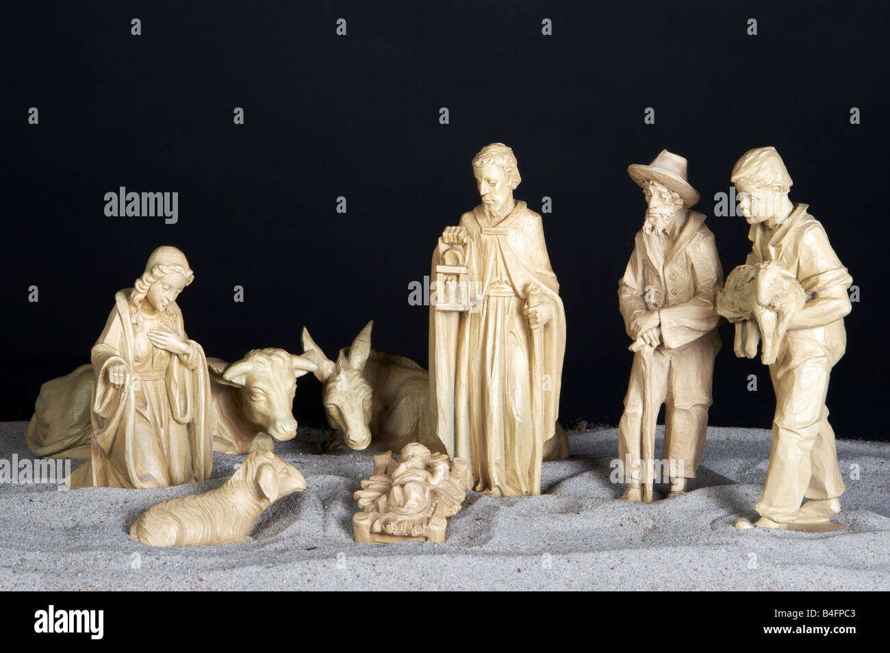 Simple old manger against a black background Stock Photo Alamy
