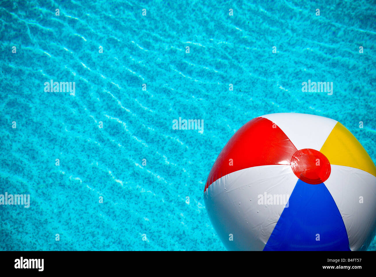 Colorful beachball floats on swimming hires stock photography and