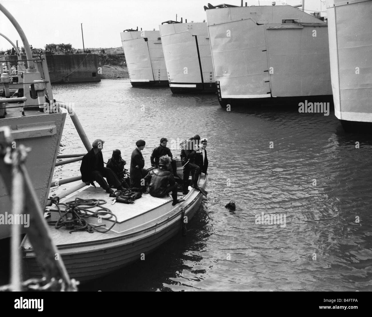 Suez Crisis 1956 British ships at anchor are checked being checked by divers Stock Photo