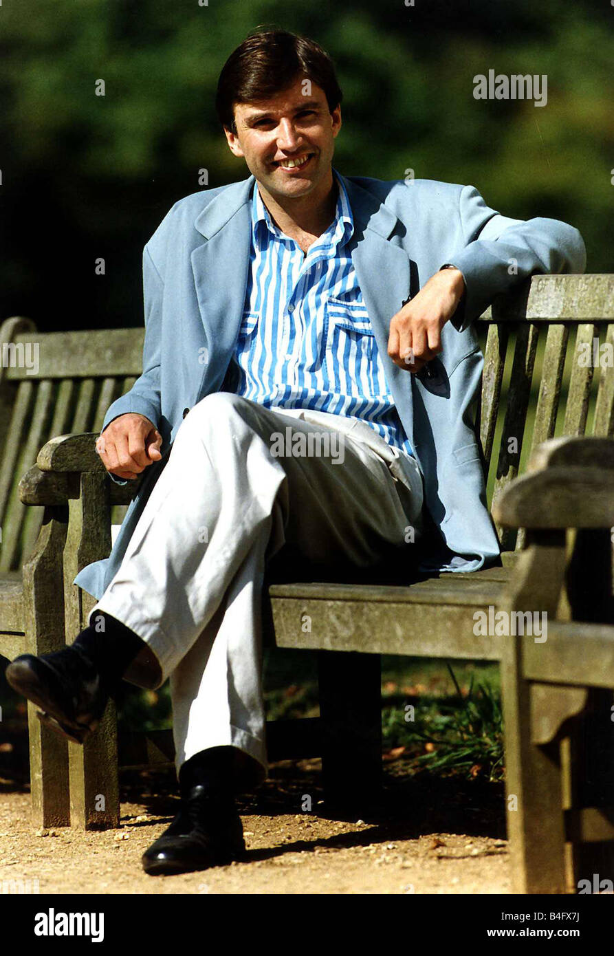 Adrian Mills Tv Presenter Actor Sitting On Park Bench Dbase