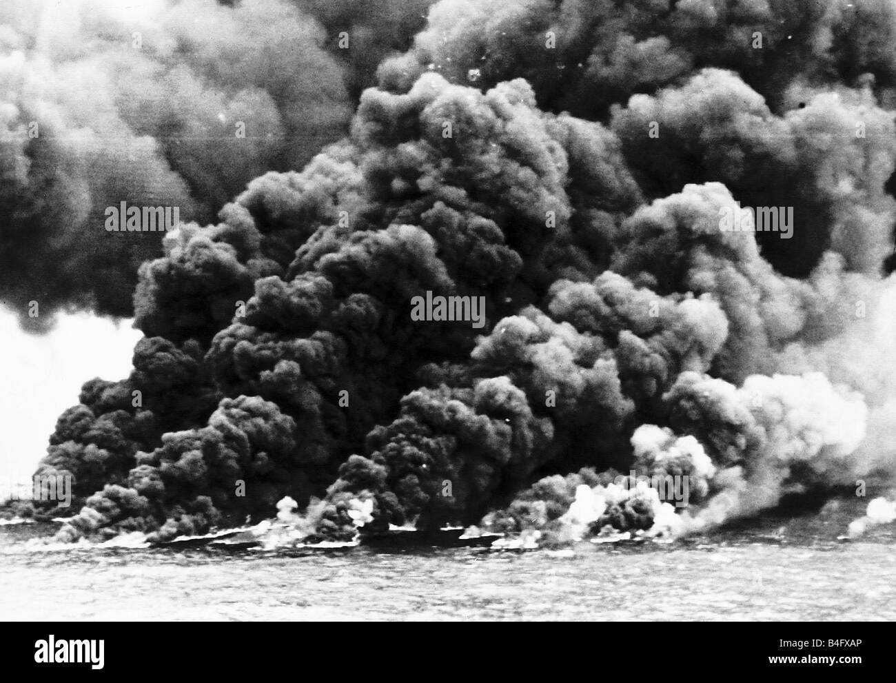 Plumes of smoke billowing out in to the sky after an intensive raid by war planes on the oil tanker Torrey Canyon March 1967 Stock Photo