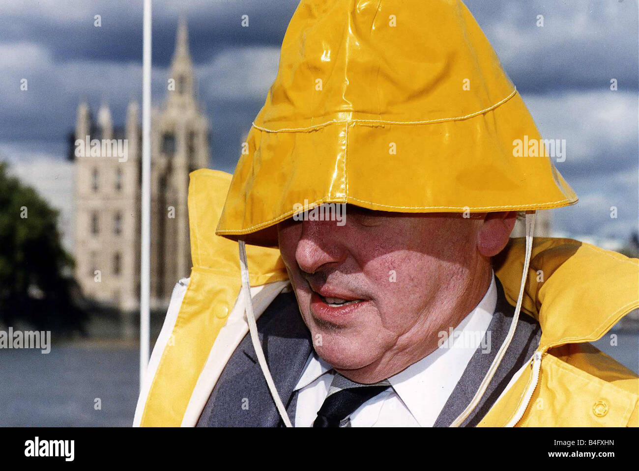 George Cole Actor in yellow souwester Mirrorpix Stock Photo