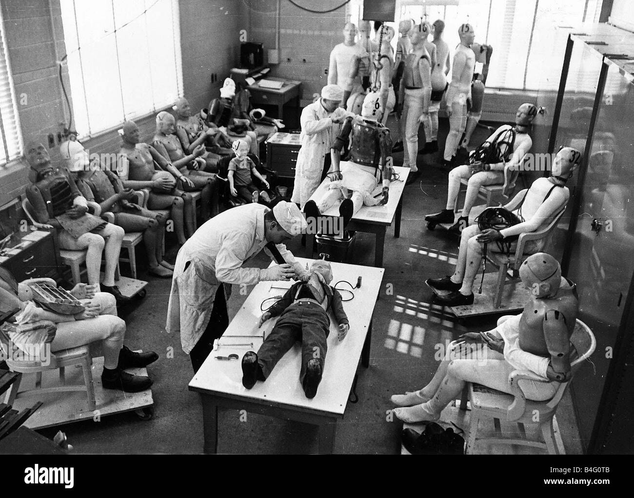 Crash test dummies being examined at a Ford test plant 1968 Stock Photo