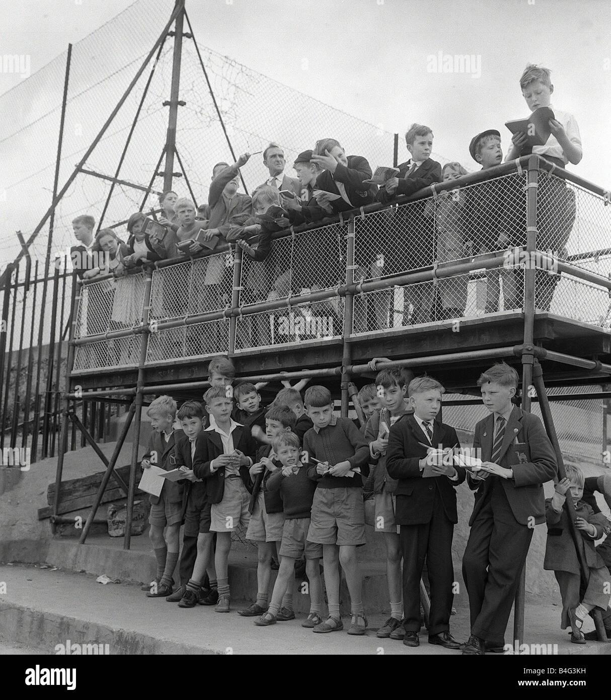 Children Train Spotting July 1960 Children spend many hours watching the trains go by from Finsbury Park They have at their disposal a train spotters platform with times of trains that travel from Kings cross to the North of England and Scotland Children Hobbies 1960 s Train Spotting trains Stock Photo