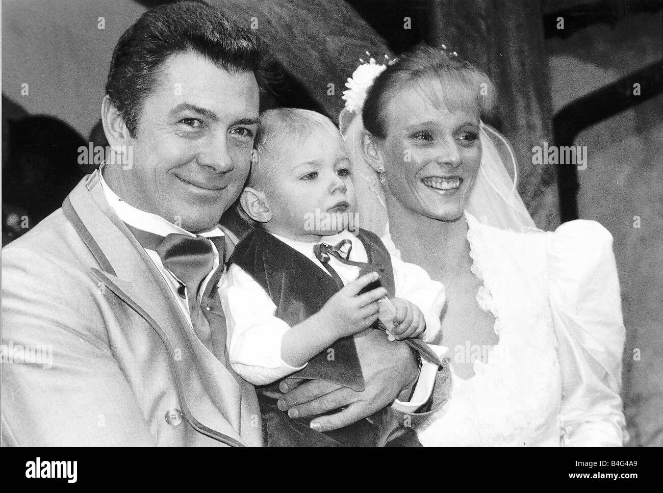 Lewis Collins Actor with wife Michelle Larrett and their 19 month old son Oliver at their wedding Stock Photo