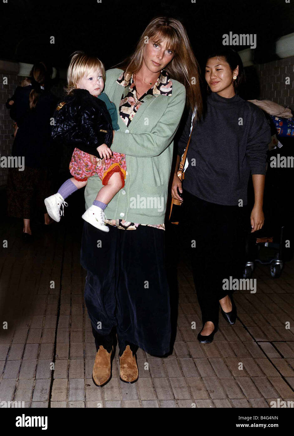 Catherine Oxenberg Actress and baby India arrive at Heathrow Airport Stock Photo