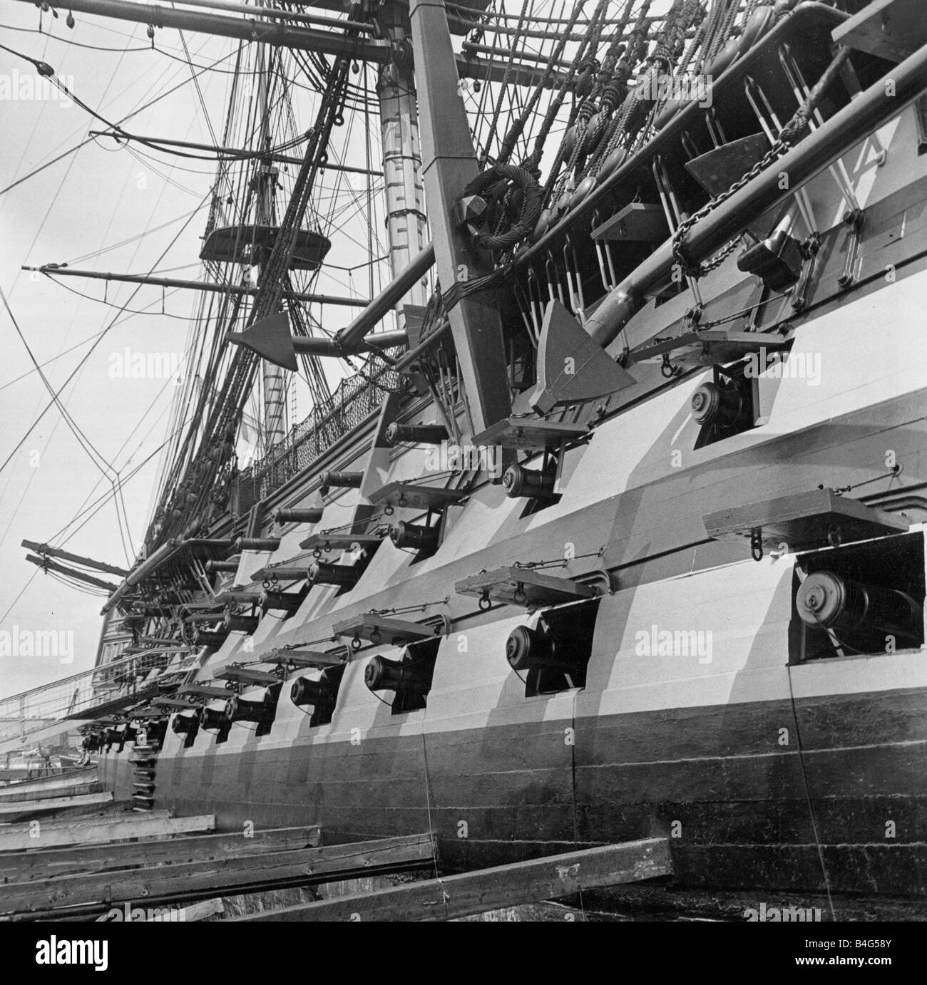 HMS Victory the Battle of Trafalgar flagship of Lord Nelson Gun ports raised the Victory s cannon peer out on the starboard side These guns naturally had no modern recoil springs and had to be dragged back with blocks and tackle every time they were fired circa 1975 Stock Photo