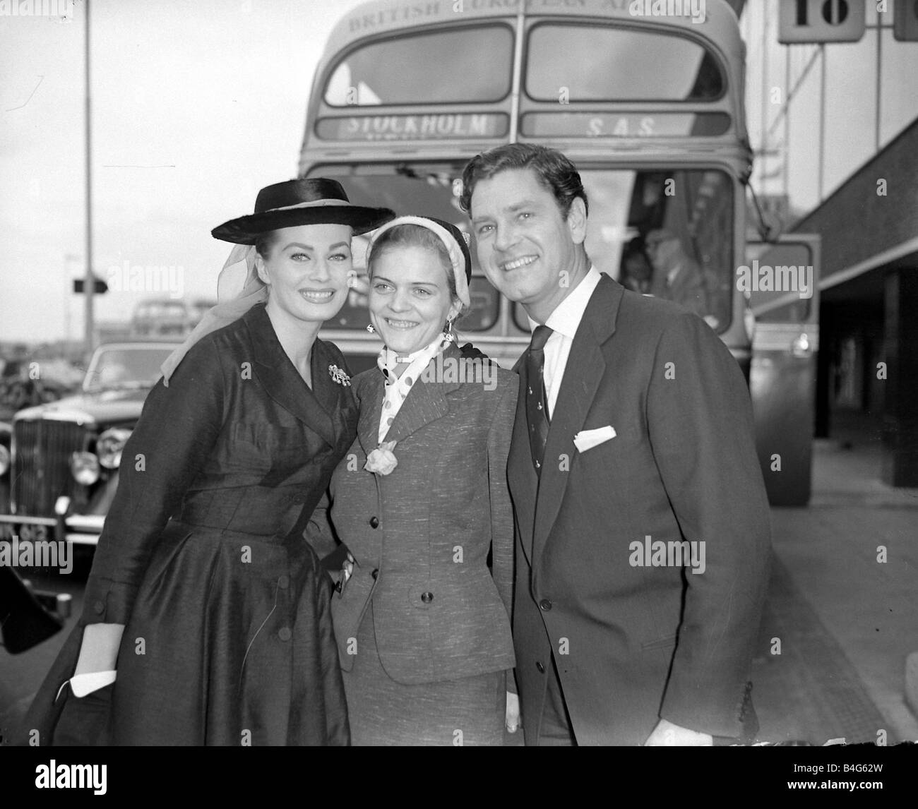 Actress Anita Ekberg left seen here with her husband Anthony Steel greeting her sister Inga centre who is visiting Britain Actress Anita Ekberg left seen here with her husband Anthony Steel greeting her sister Inga centre who is visiting Britain Stock Photo