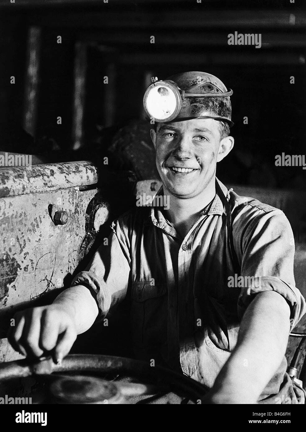Coal Miner James Turner from Newcastle who drives an electric shuttle car down the mine in 1947 Stock Photo