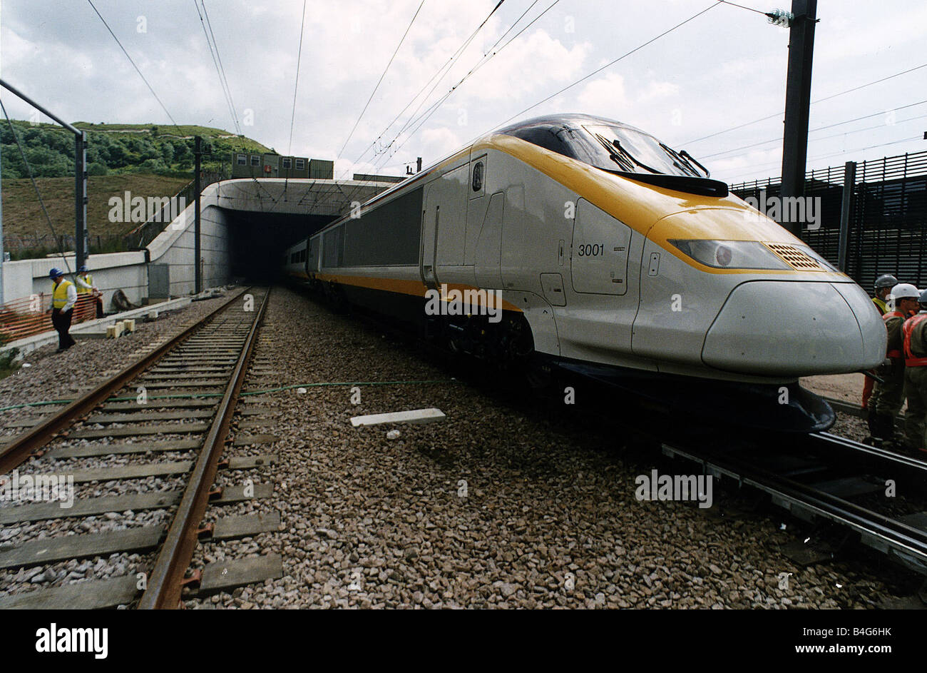 A Eurostar express train emerges from the mouth of the Channel tunnel on a test run from Folkestone to Calais Stock Photo