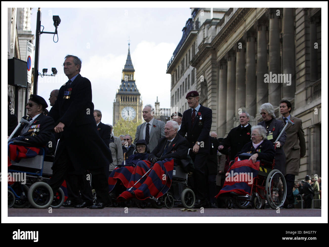 The Queen leads the nation in remembrance along with other members of the royal family leading politicians and veterans during the Remembrance Sunday Service The Cenotaph Whithall Our Picture Shows Disabled veterans prepare to parade pass The Cenotaph in an act of remembrance November 2005 Stock Photo