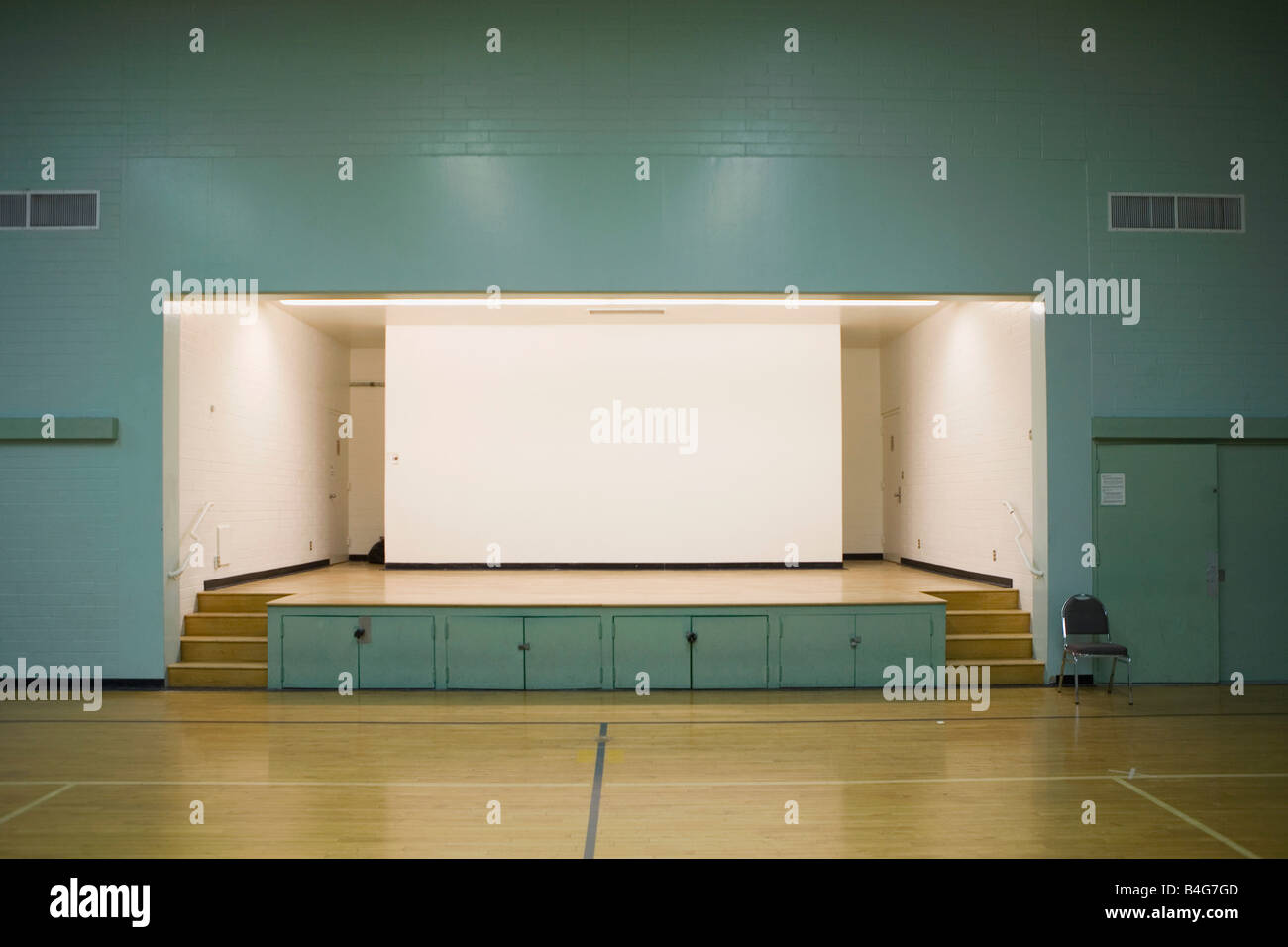 An illuminated stage in a gymnasium Stock Photo Alamy