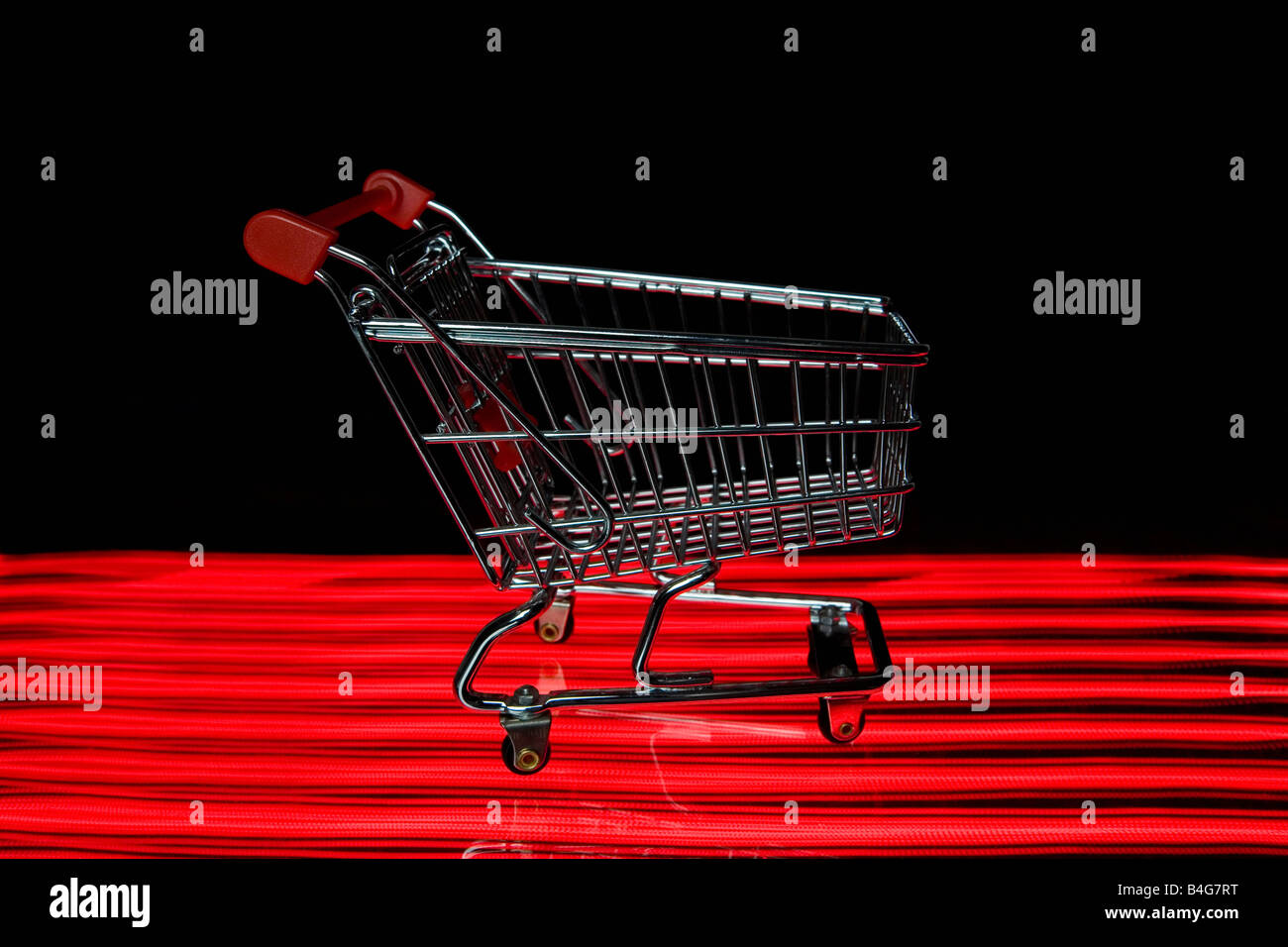 A miniature empty shopping cart Stock Photo