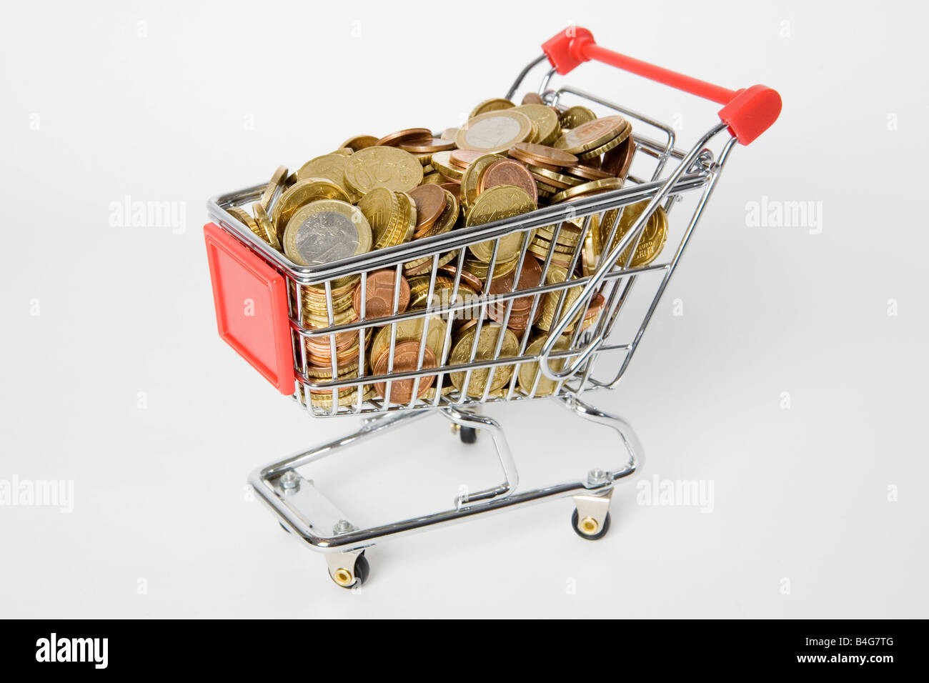 A miniature shopping cart full of European Union coins Stock Photo Alamy