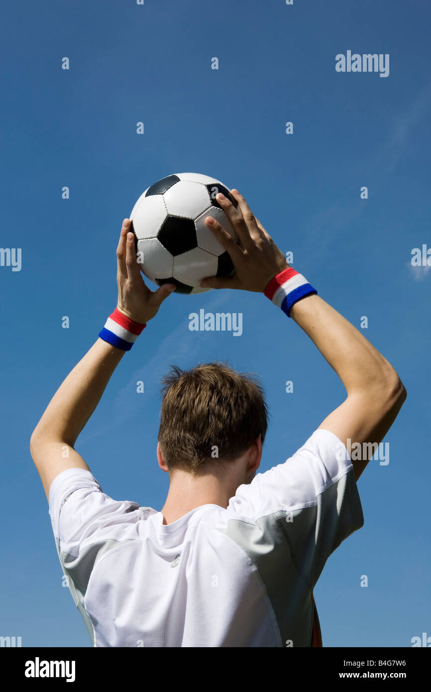 A soccer player throwing a soccer ball Stock Photo Alamy