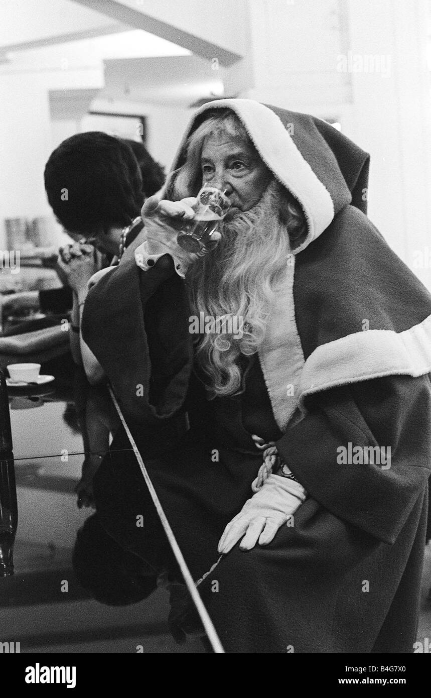 Father Christmas drinking in a cafe bar in Paris December 1963 Stock Photo