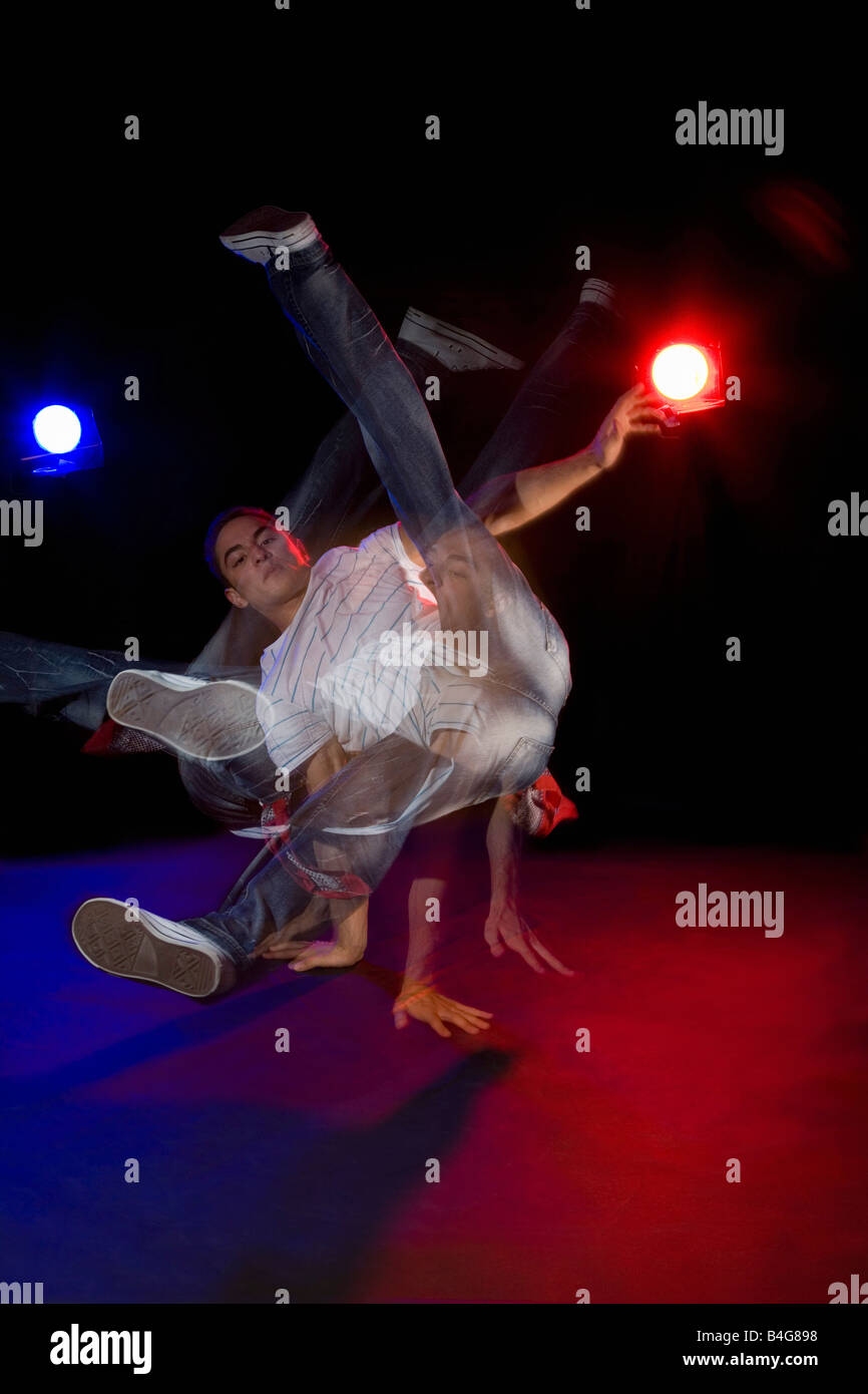 A B-boy doing a  Flare breakdance move, stroboscopic effect Stock Photo