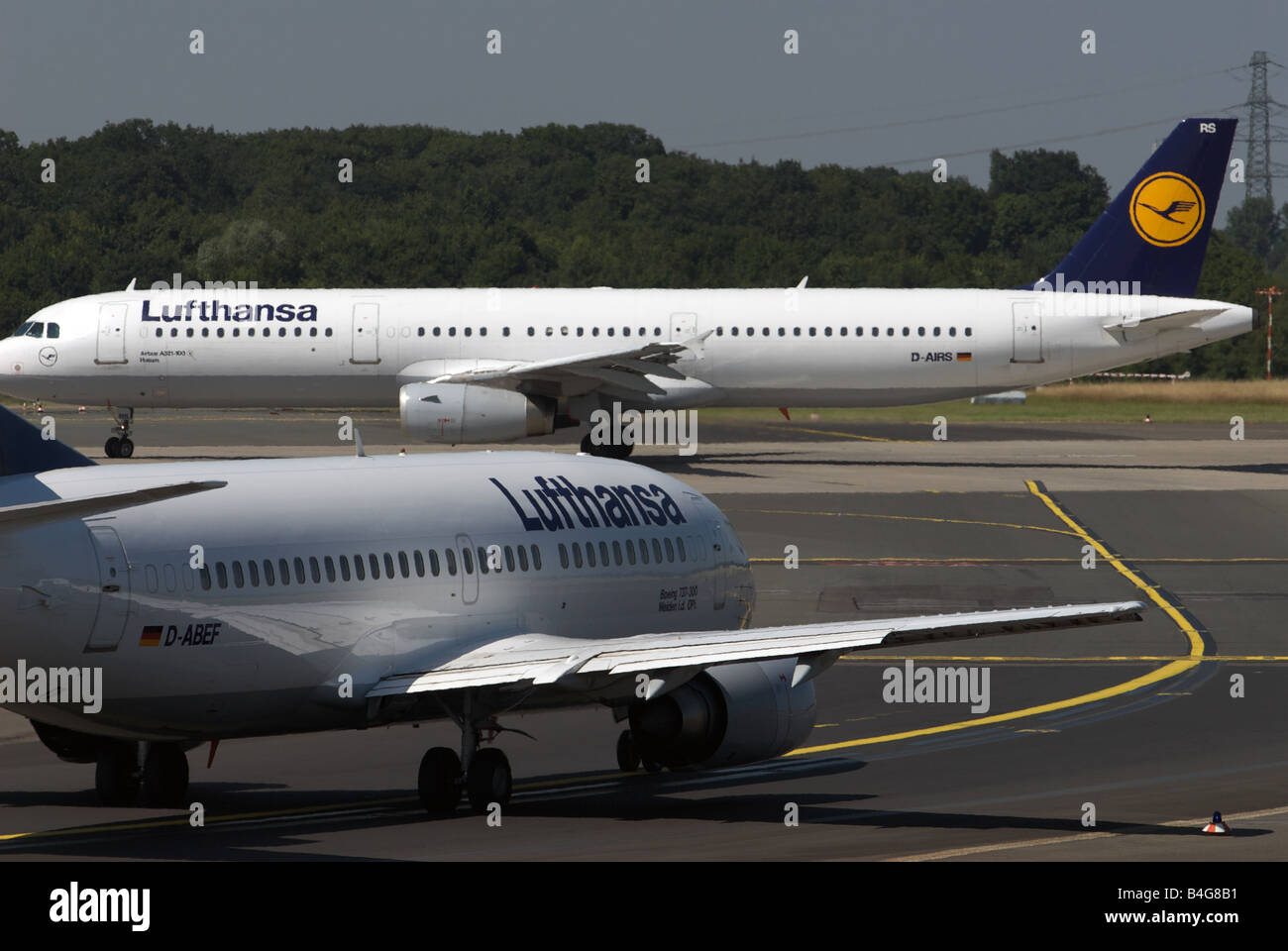 Lufthansa Boeing 737-300 and Airbus A321-100 taxiing to the runway, Dusseldorf International Airport, Germany. Stock Photo