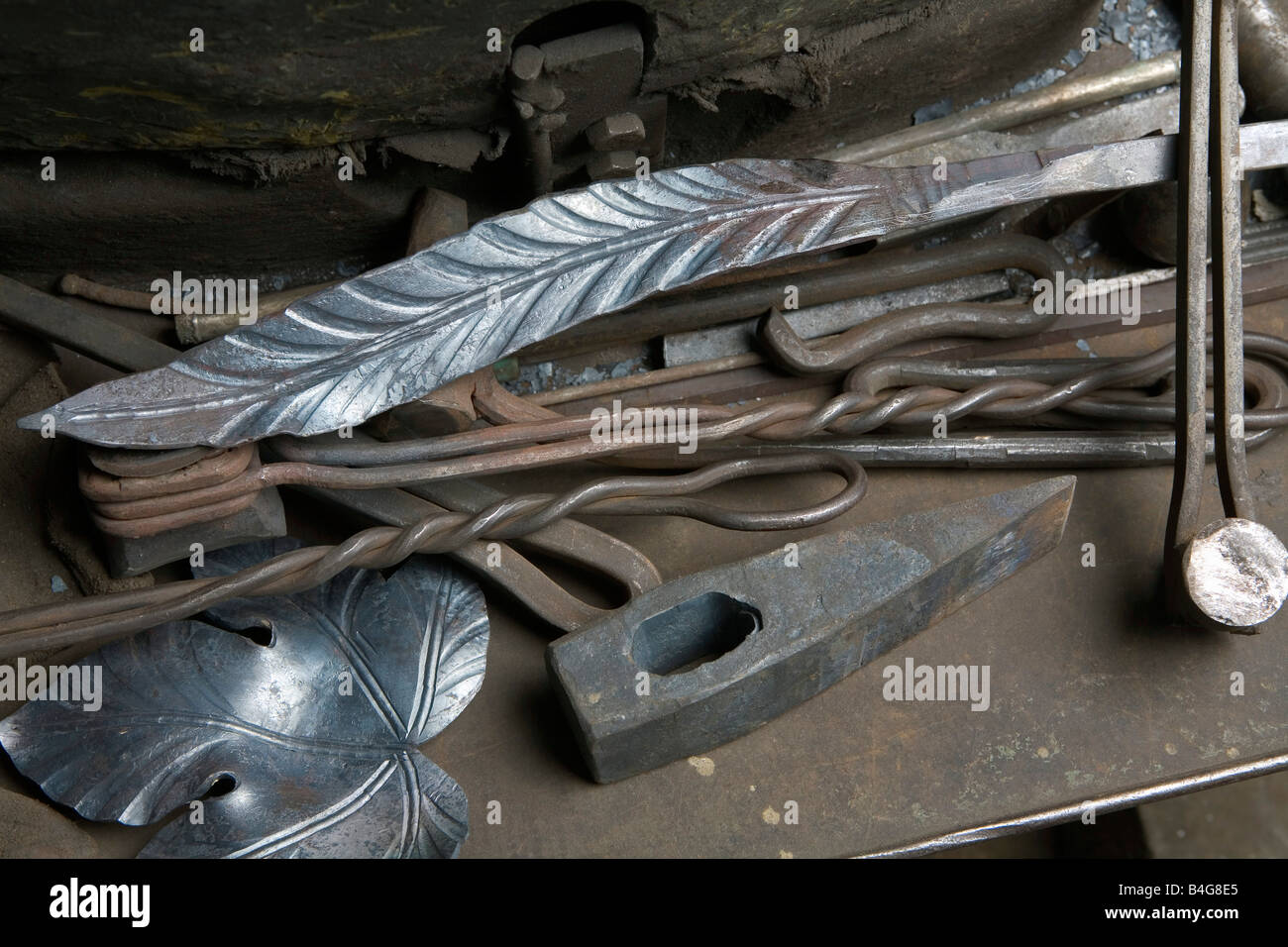 Pieces of crafted metal and metalwork tools Stock Photo