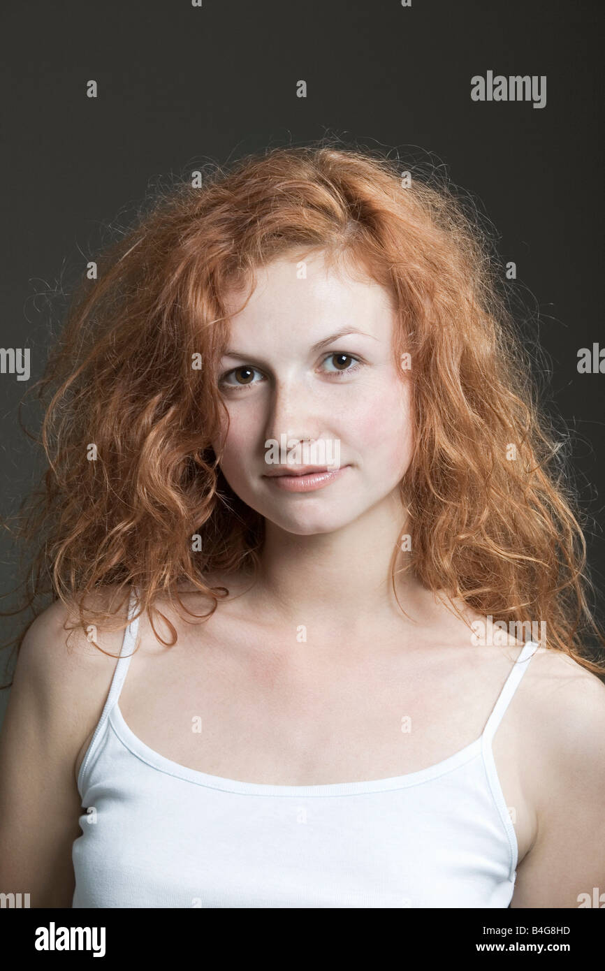 Portrait of a young woman with red hair Stock Photo - Alamy