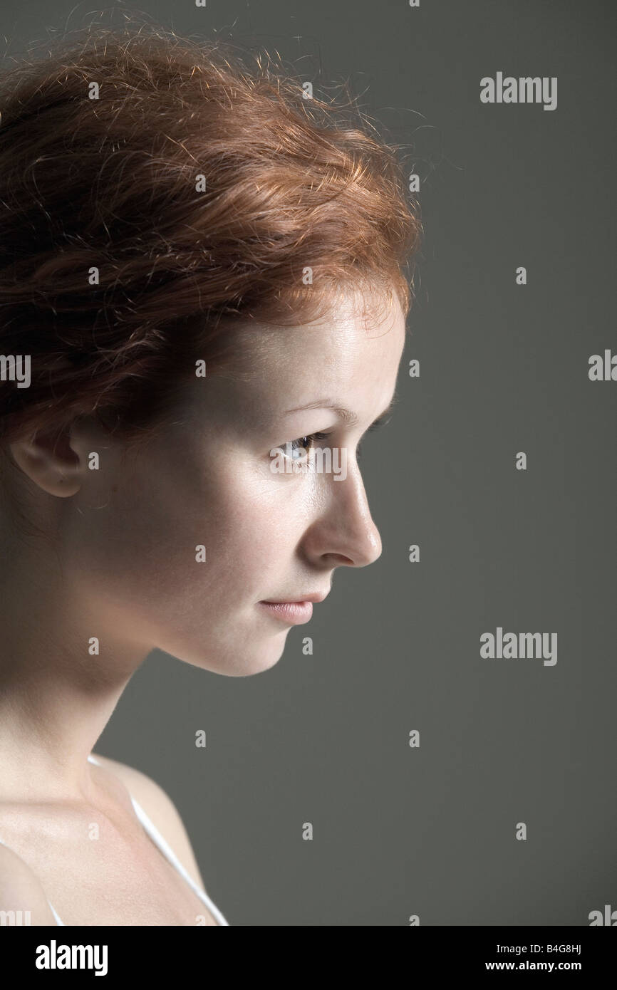 Portrait of a young woman with red hair Stock Photo - Alamy