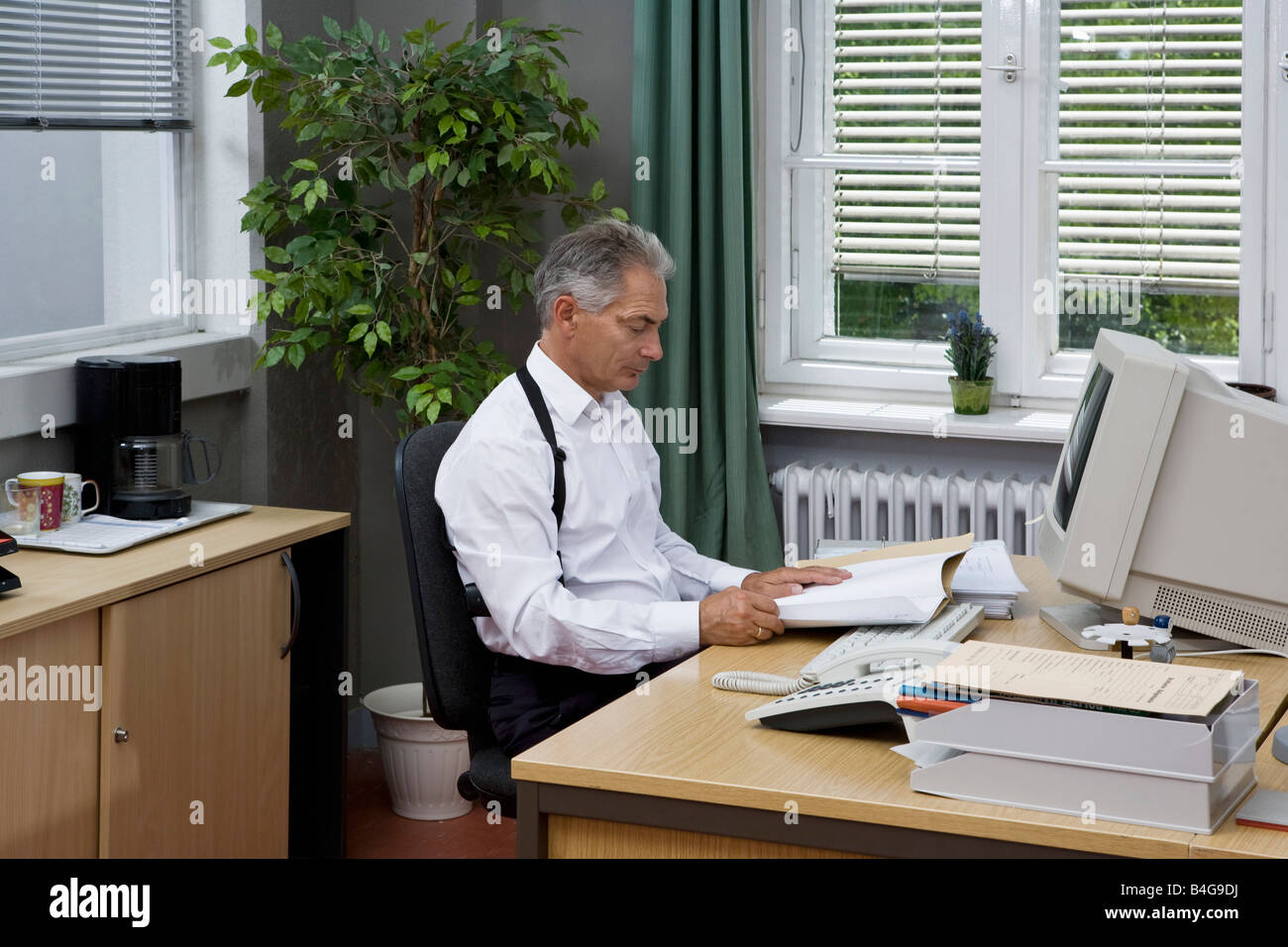 A police officer working in an office Stock Photo Alamy