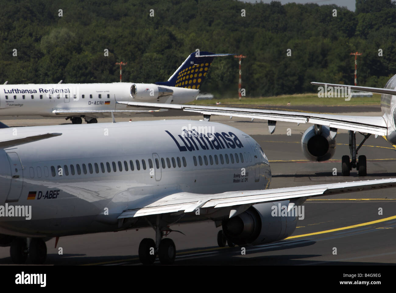 Lufthansa passenger aircraft taxing to the runway at Dusseldorf International Airport, North Rhine-Westphalia, Germany. Stock Photo