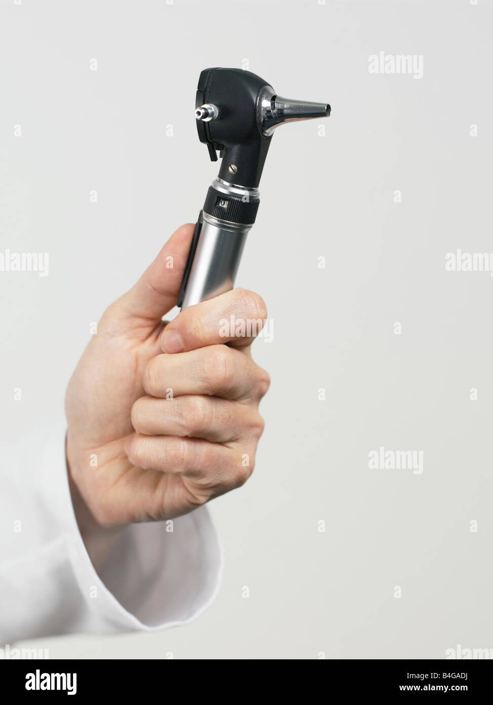 Human hand holding an otoscope Stock Photo Alamy
