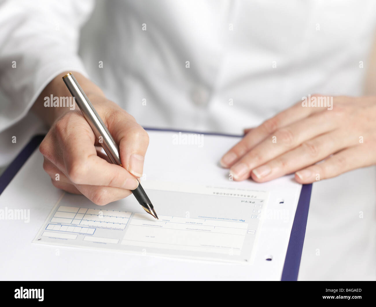 Human hands filling out medical paperwork Stock Photo Alamy