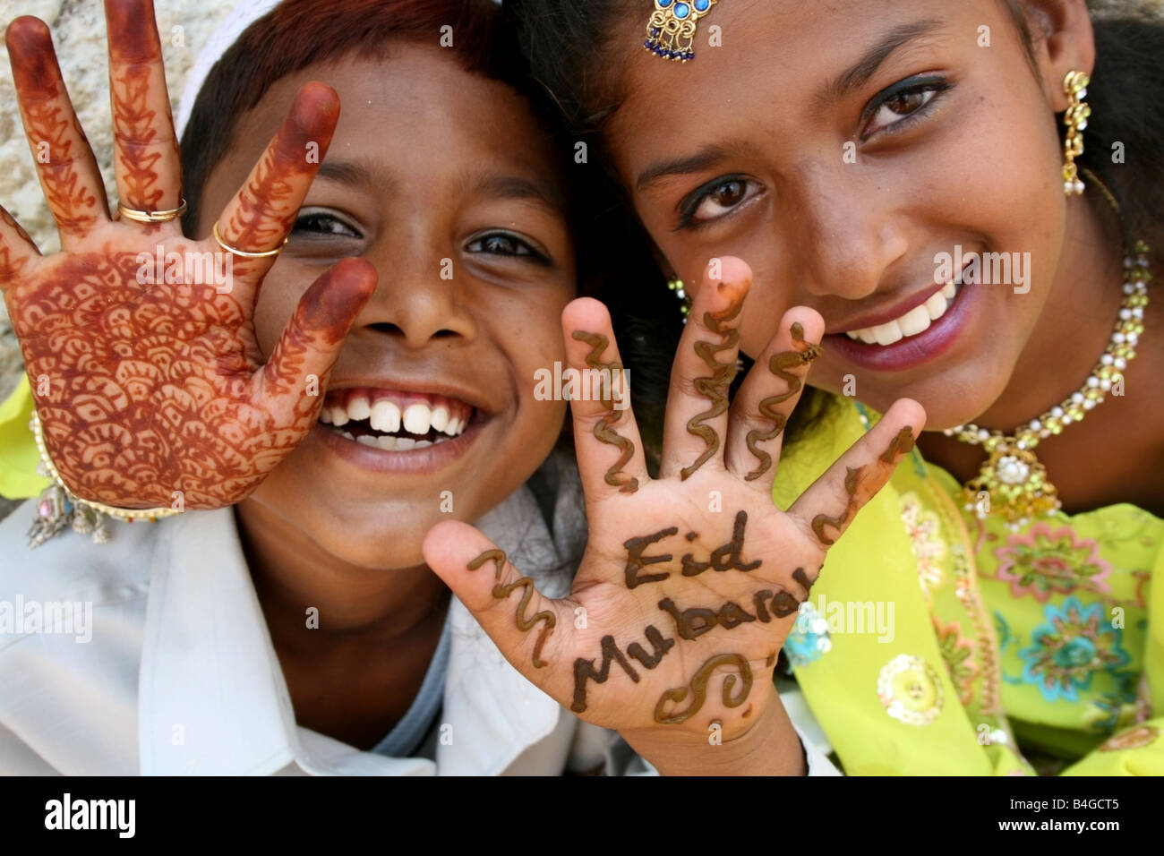 Moslem children with Eid Mubarak henna on their hands , Eid ul Fitr celebrations , India Stock Photo
