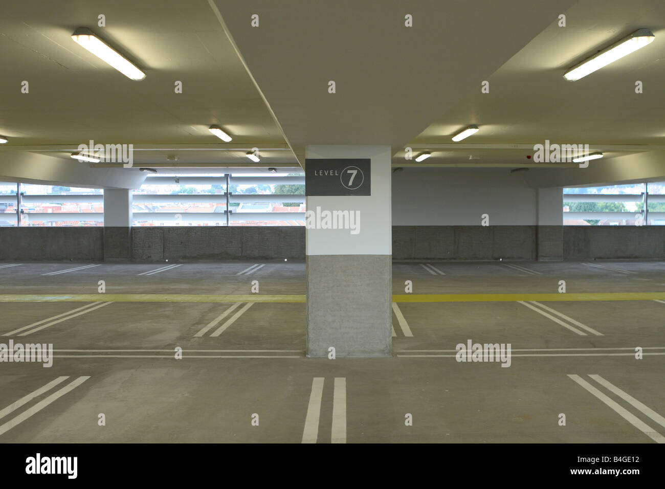 Multi storey car park parking spaces concrete and strip lights Stock Photo