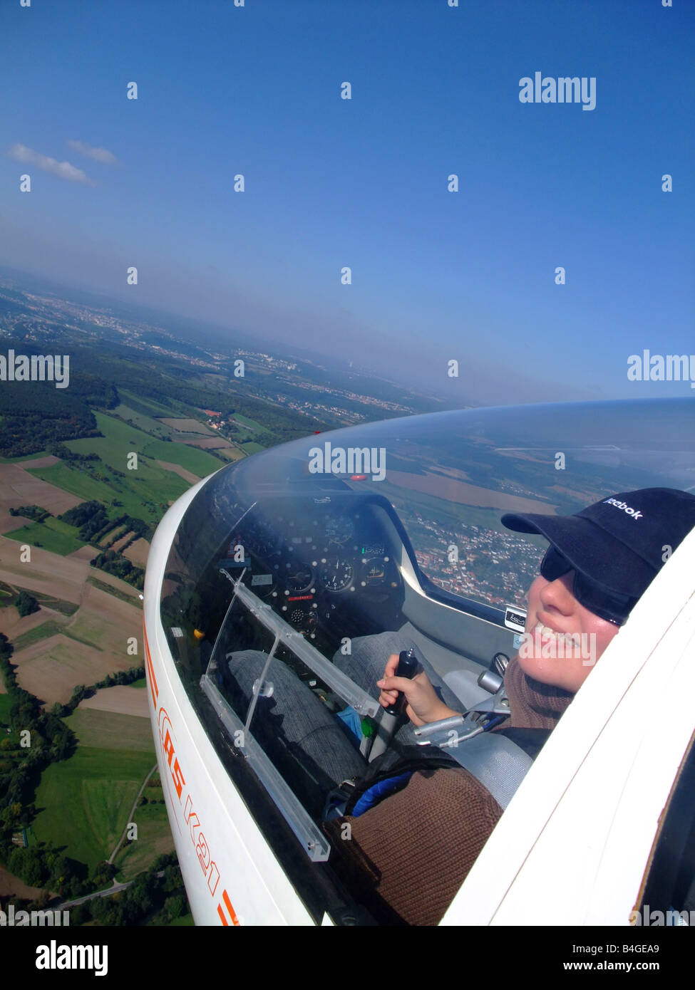 A young woman glider pilot outside view during the flight – Glider model ASK-21 - France Stock Photo