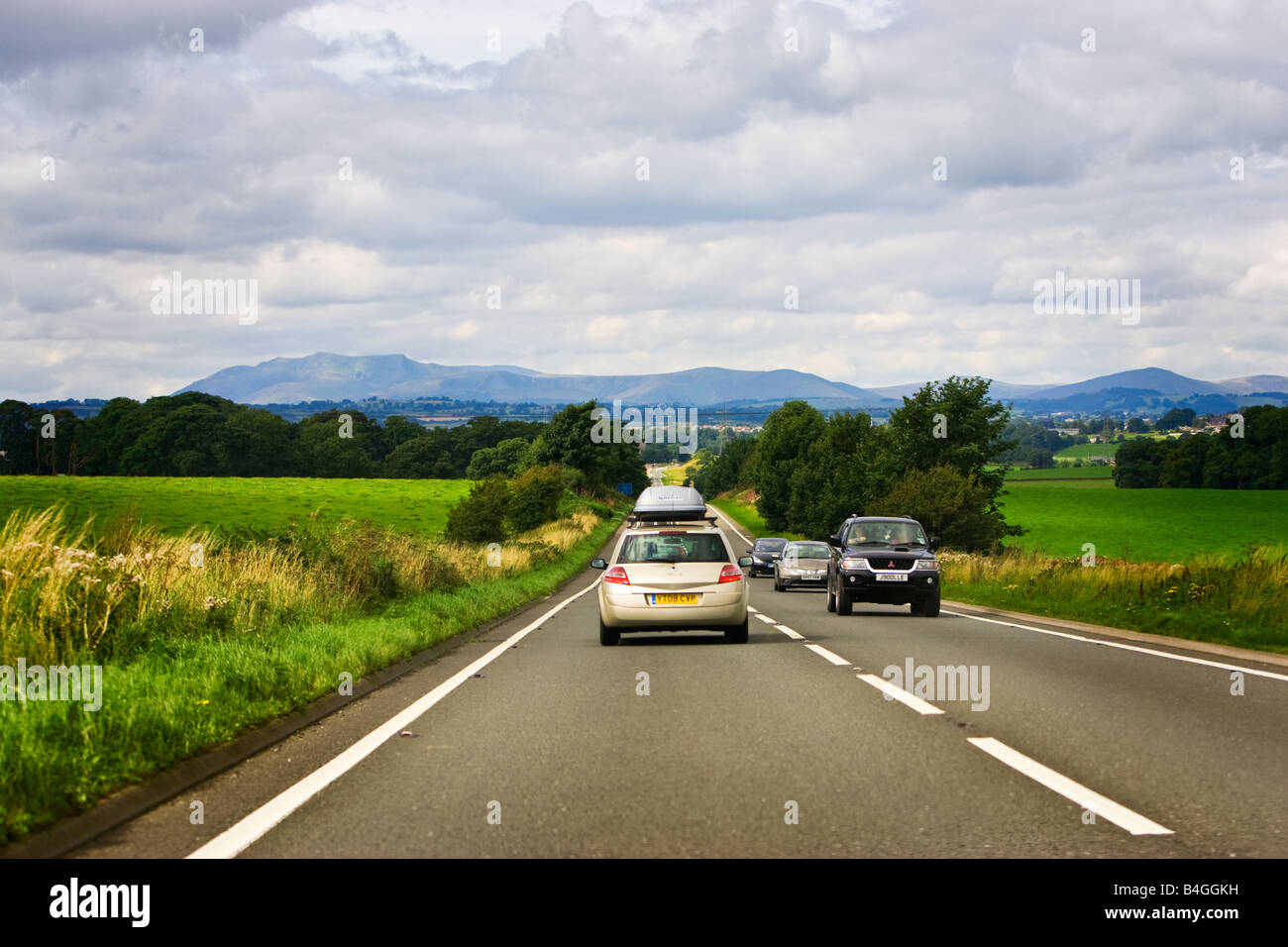 Vehicles on an A66 road route journey across the Pennines driving towards Cumbria, England, UK Stock Photo