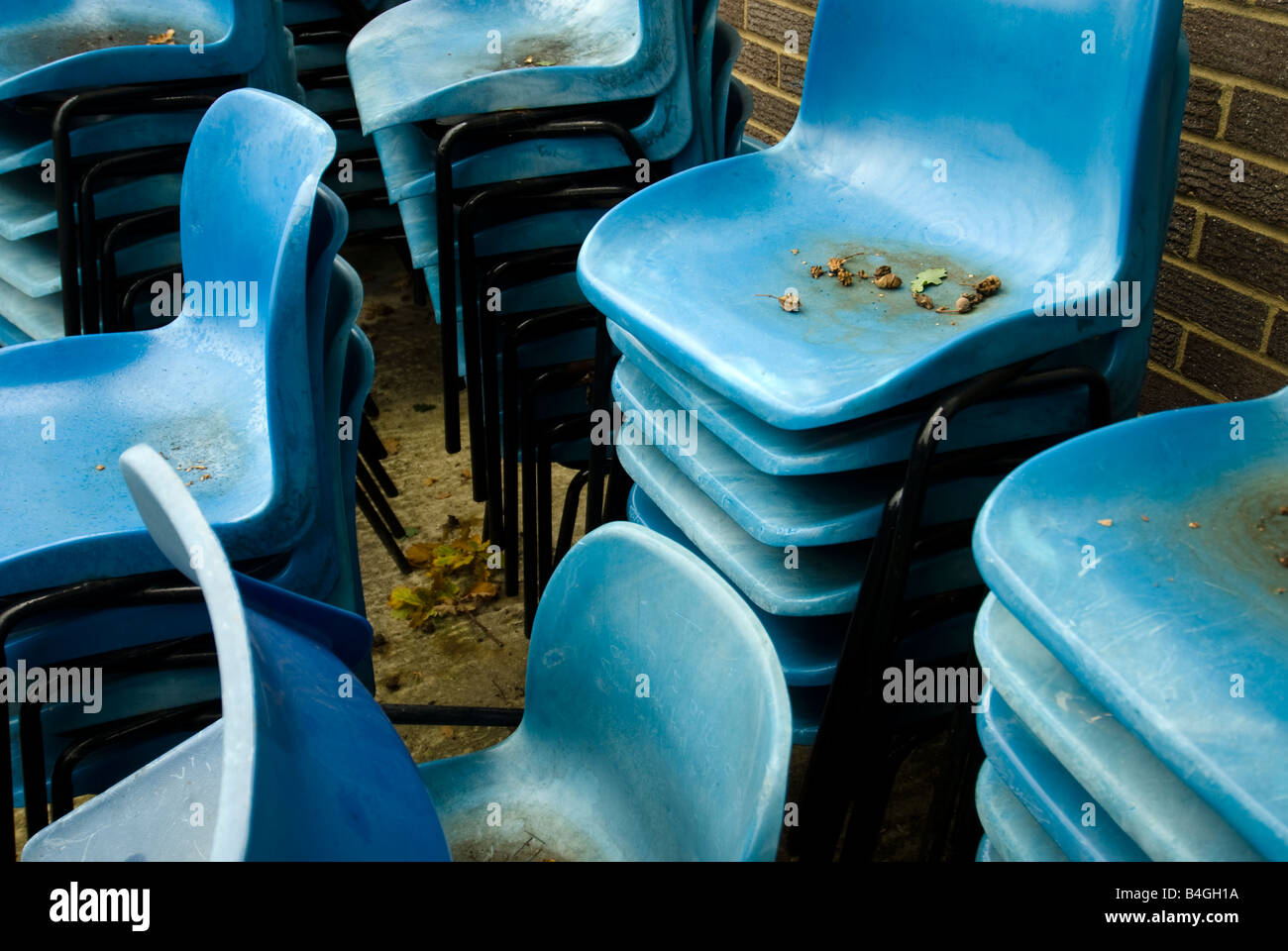 stacks of blue plastic chairs Stock Photo - Alamy
