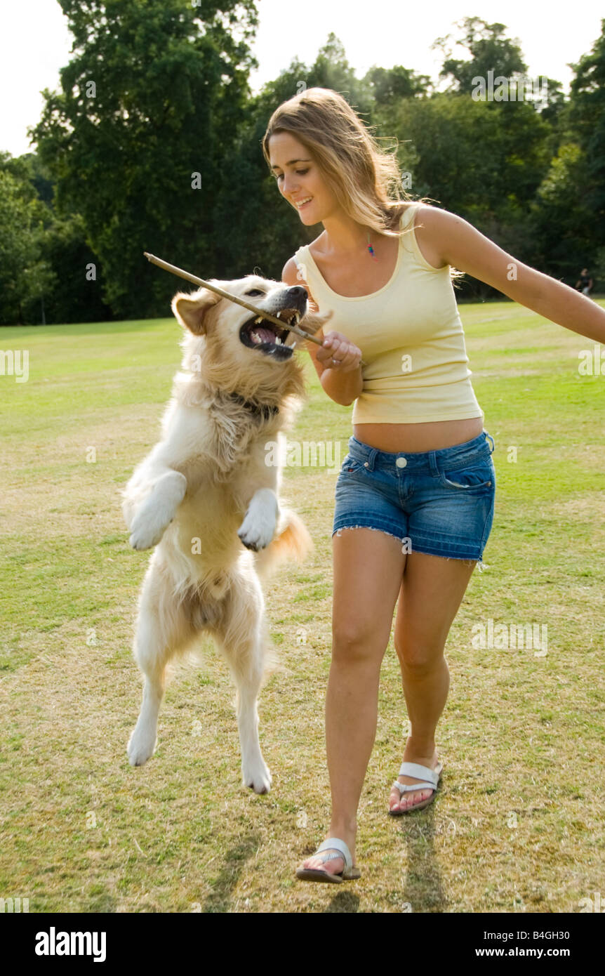 Teenage Girl Playing With Her Dog Stock Photo Alamy