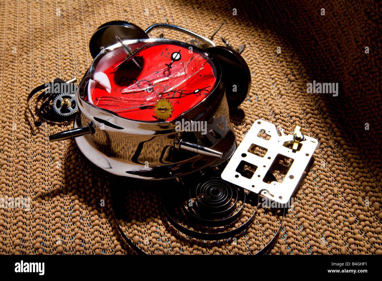 Smashed alarm clock in pieces Stock Photo Alamy