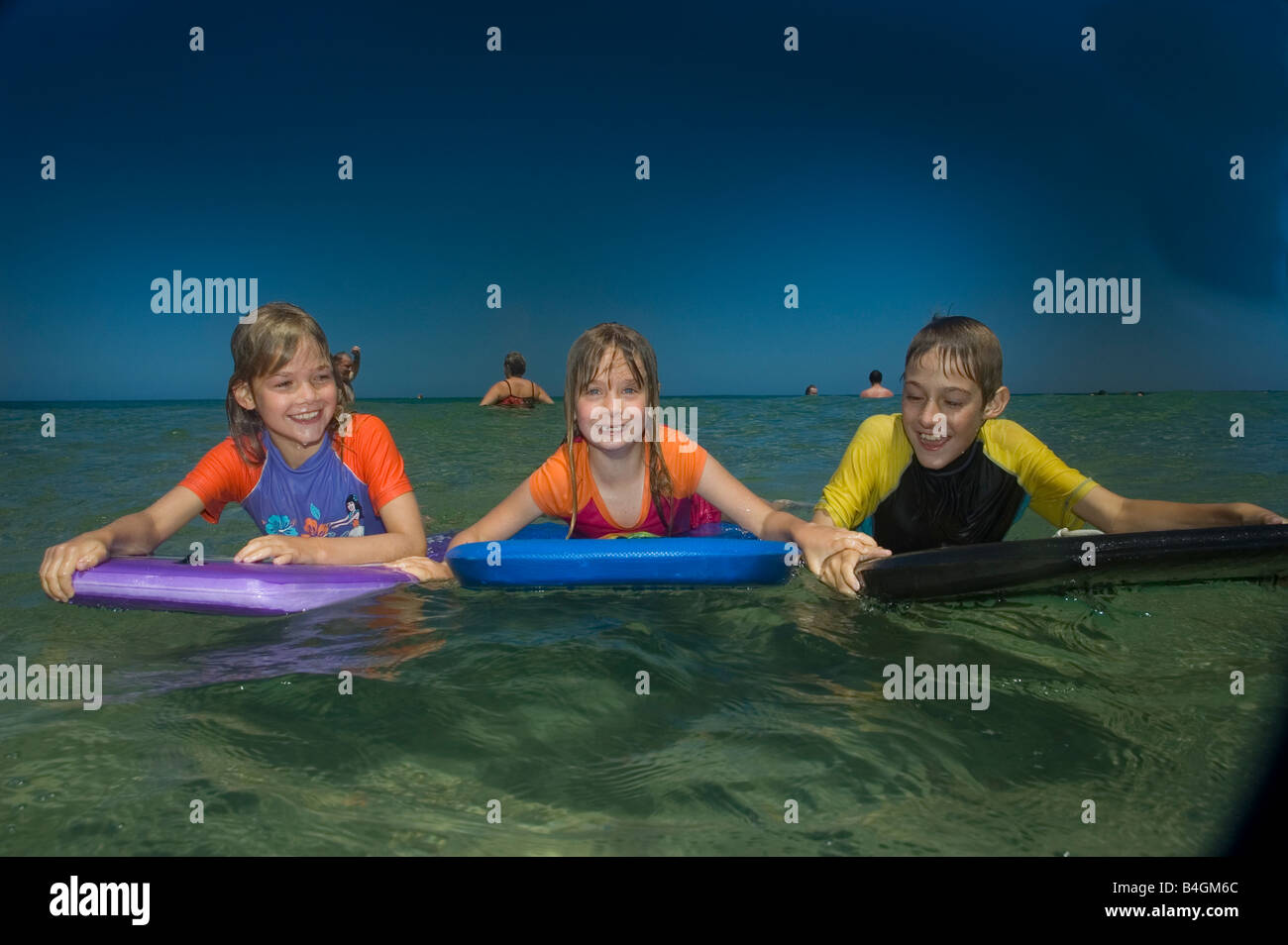 kids swimming at the beach Stock Photo Alamy