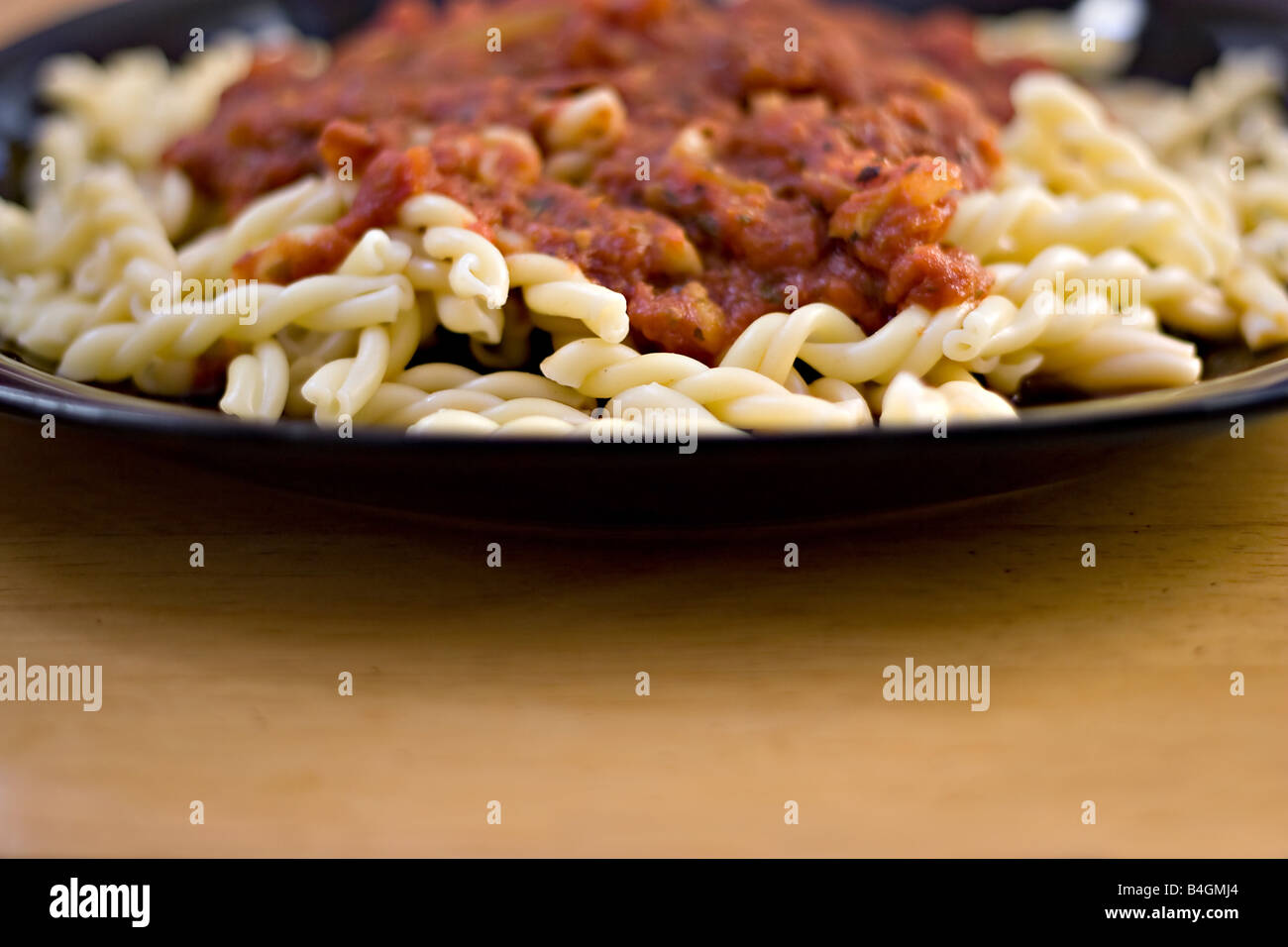 A delicious homemade Italian meal A plate of gemelli pasta with fresh homemade marinara sauce Stock Photo