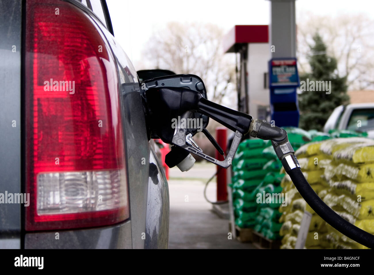A vehicle fills up at the gas station. Stock Photo