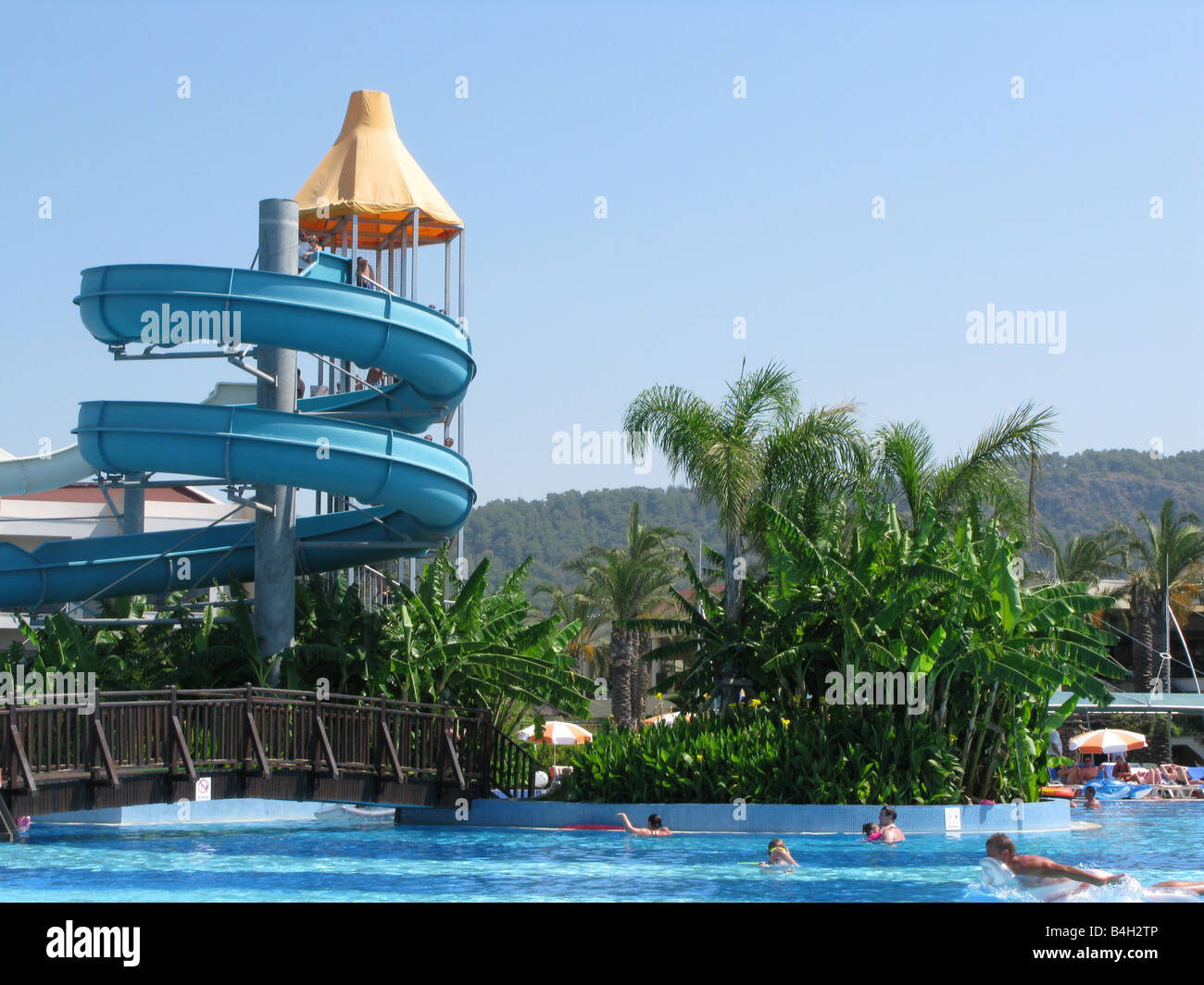 Swimming pool with water slide, turkey Stock Photo